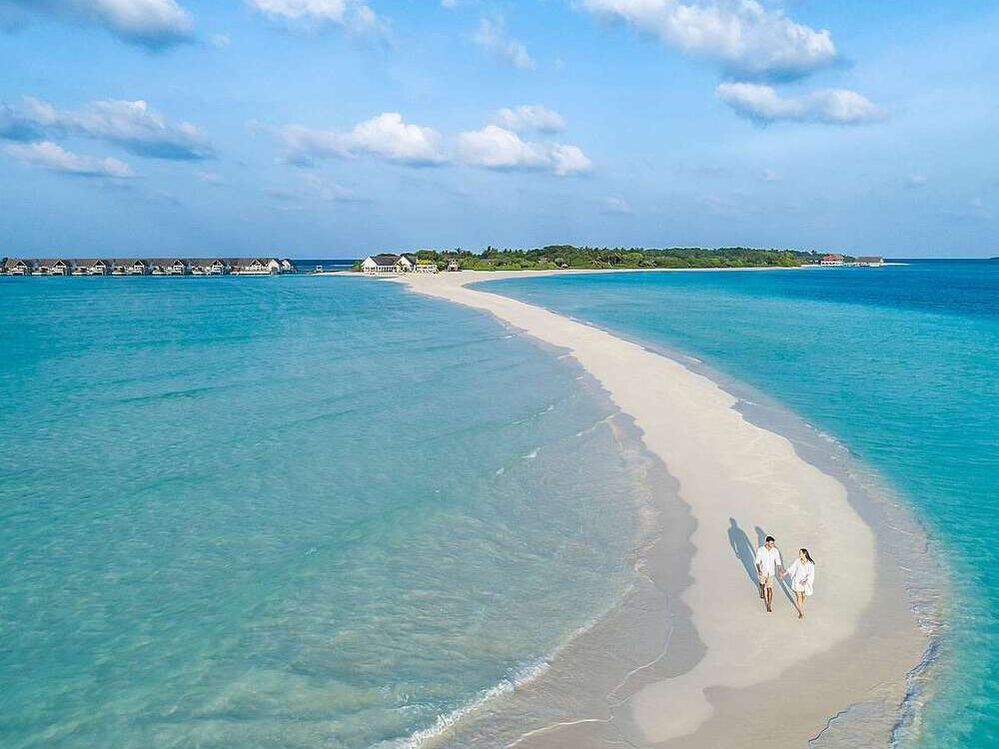 Four Season Resort walking on beach ocean Maldives
