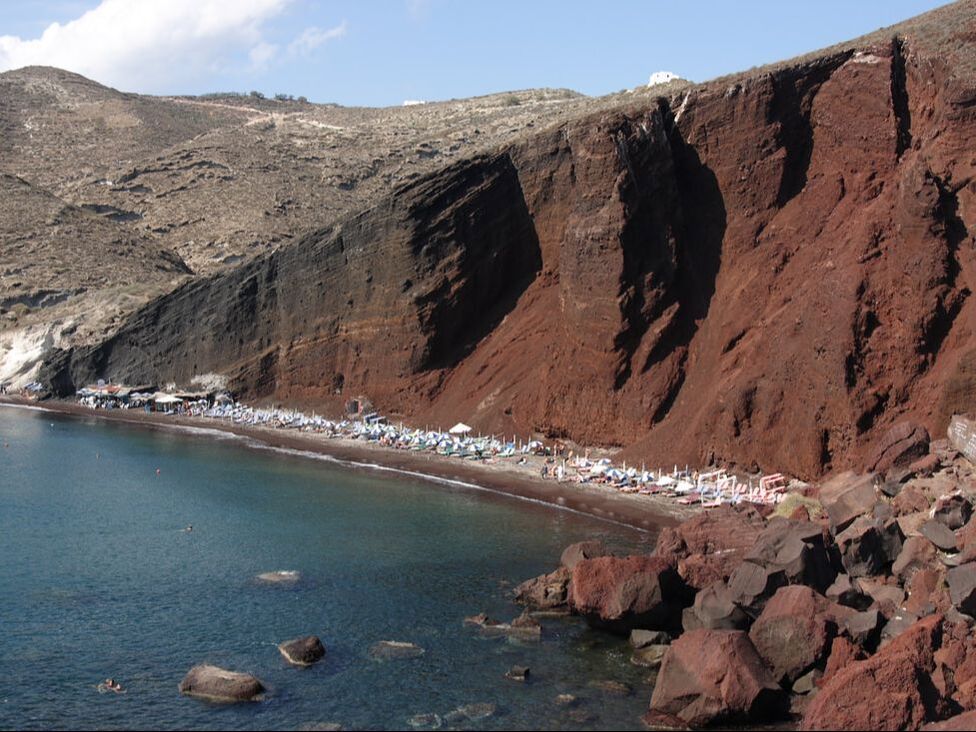 Red cliffs and beach of Santorini Greece