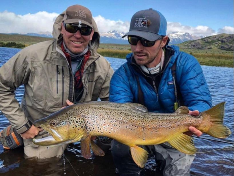 Guide and client giant brown trout Estancia Tecka Argentina