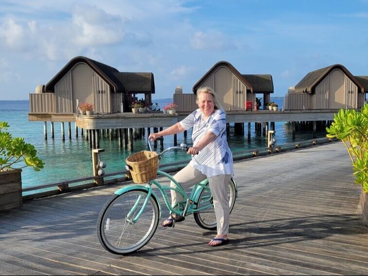 Kim happy biking at Joali Maldives